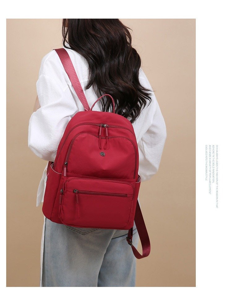 A close-up view of backpack stitching and material, emphasizing quality control